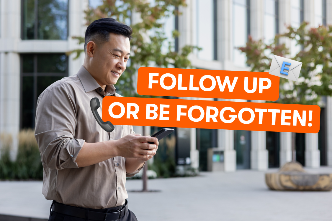 A man walking and using his phone 