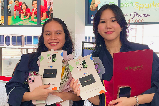 Graduates receiving personalised NFC business cards as graduation gifts
