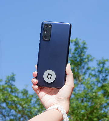Mini NFC Sticker attached to the back of a smartphone