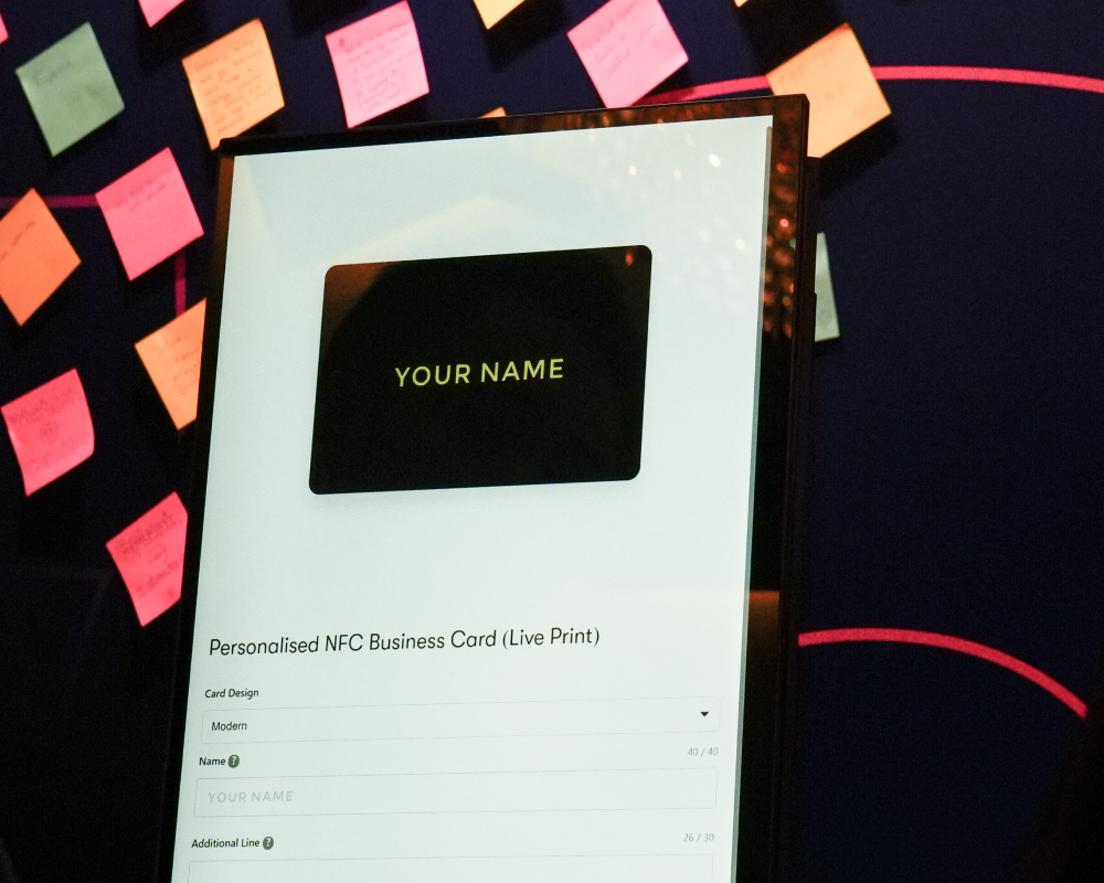 Interactive live NFC business card printing kiosk at an event booth