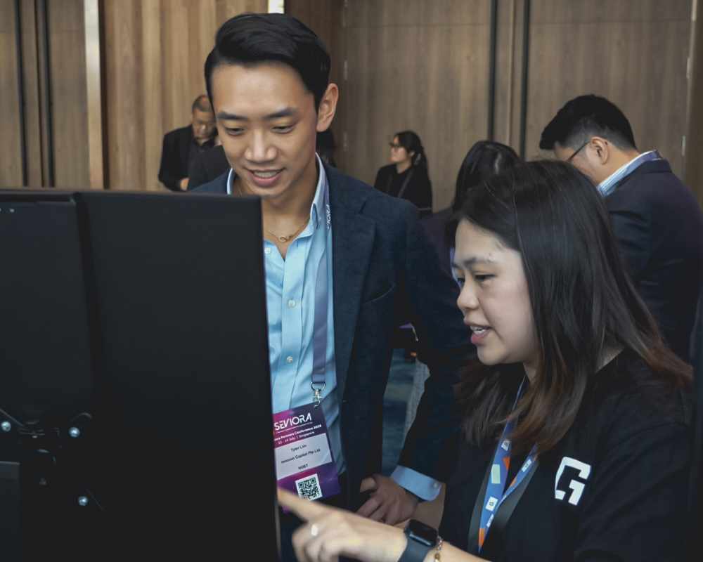 One Good Card event staff supporting attendees at a live NFC printing booth