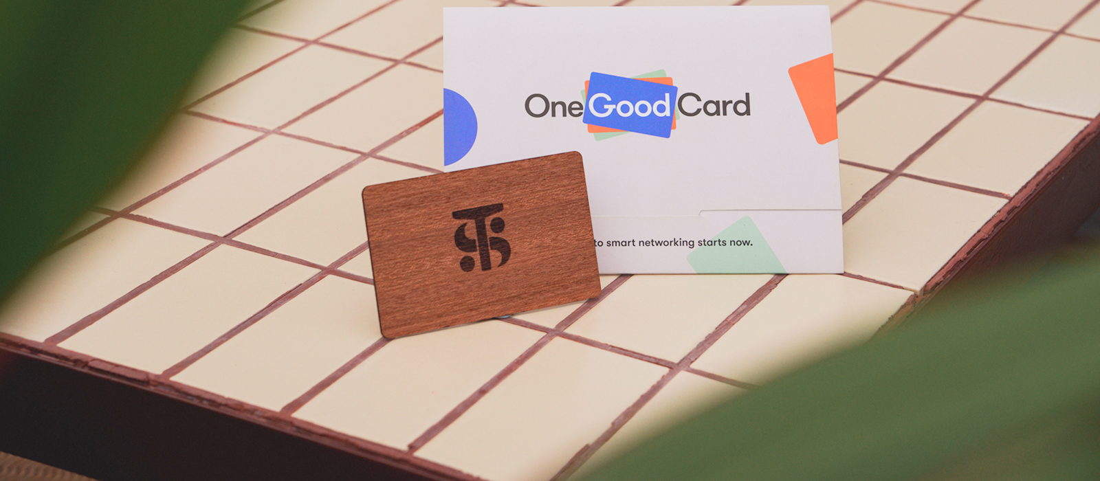 Laser-engraved wooden NFC business card customised with a company logo
